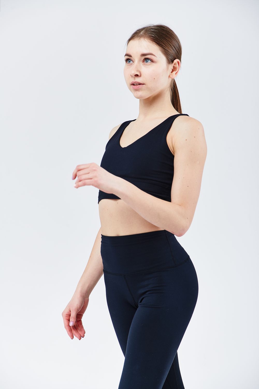 Woman wearing a black tank top suitable for private label activewear development