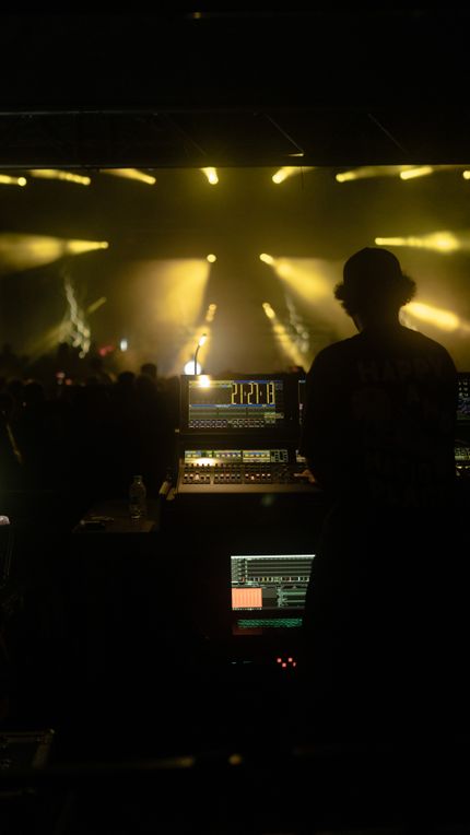 Front-of-house desk during a show — photo by Sami Abdullah on Pexels
