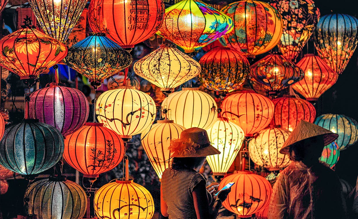 Free Two Person Standing Near Assorted-color Paper Lanterns Stock Photo
