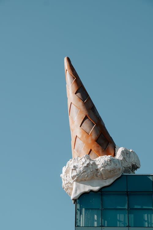 Statue of an Ice Cream Cone on the Building Rooftop 