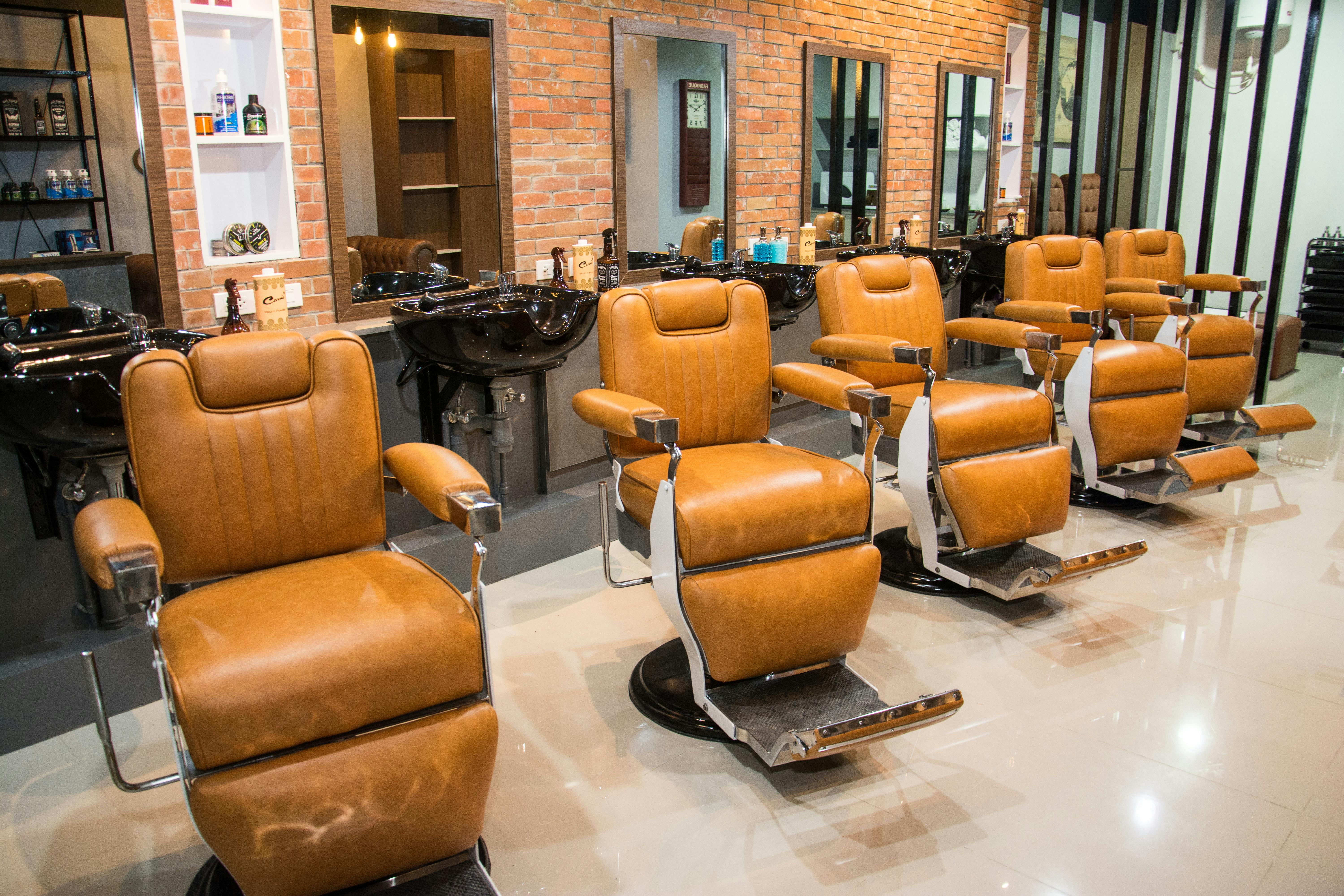 Brown Leather Barbers Chairs in a Barber Shop · Free Stock Photo