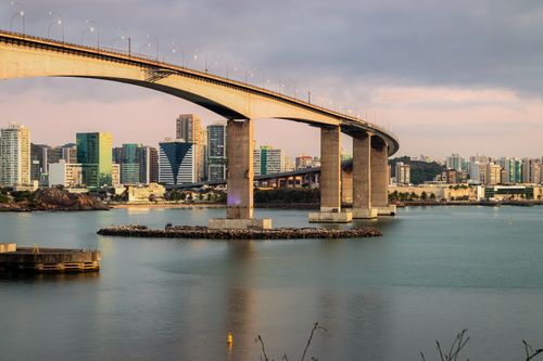 Free Beautiful sunset over Third Bridge in Vitória, Brazil, with cityscape and water reflections. Stock Photo