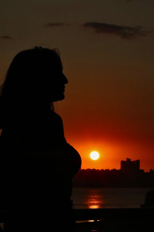 Silhouette of a Woman during Sunset