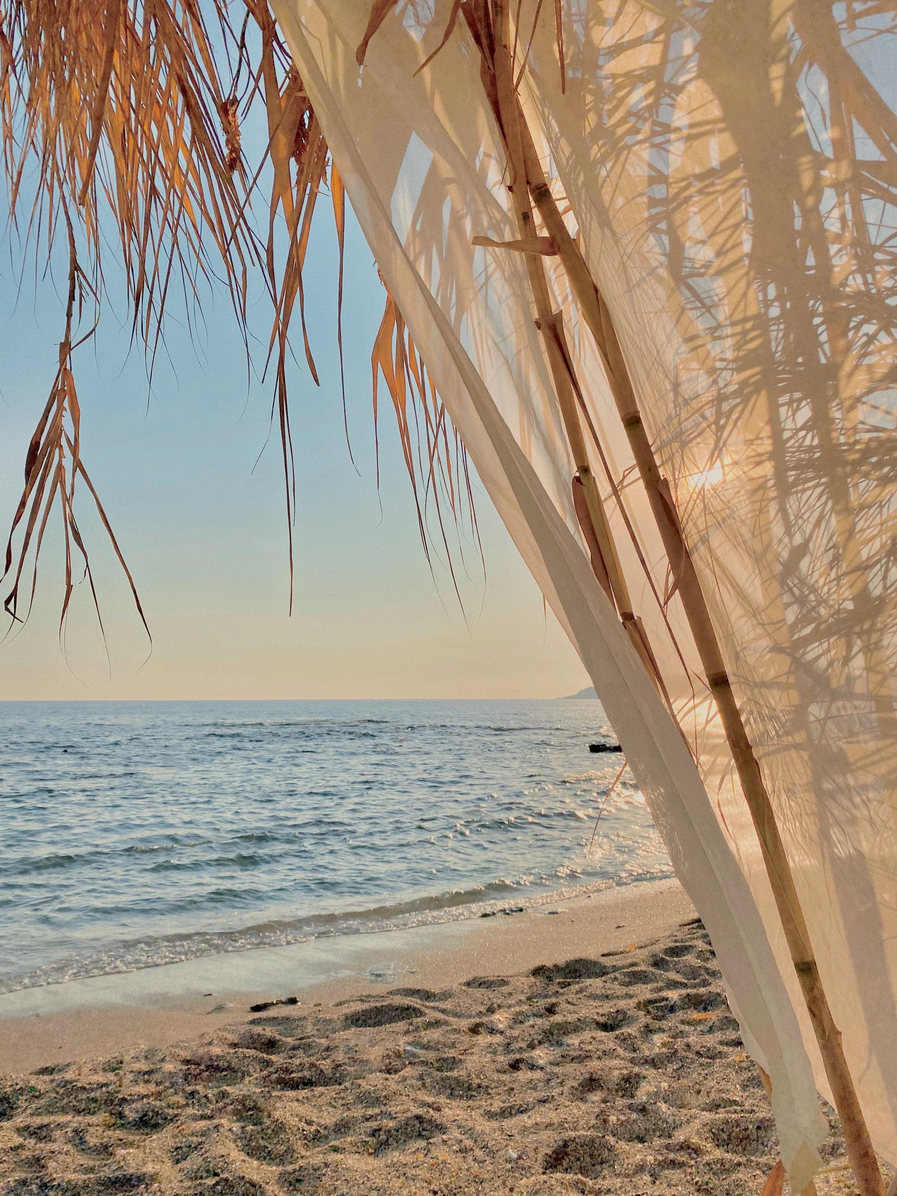 Relaxing beach view with a canopy on a sunny day in Turkey. Ideal for travel and lifestyle imagery.