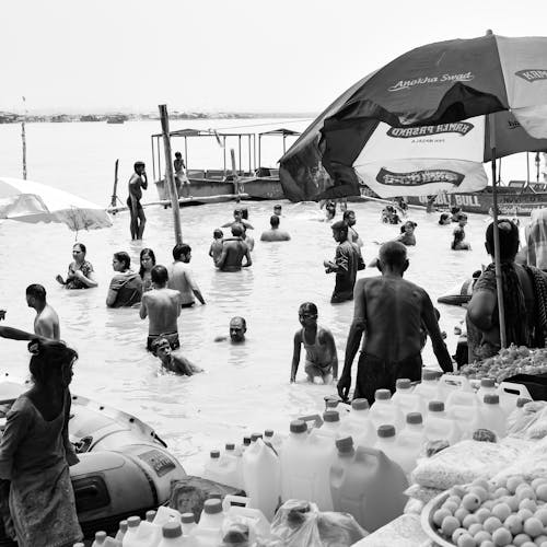 Grayscale Photo of People on the Beach