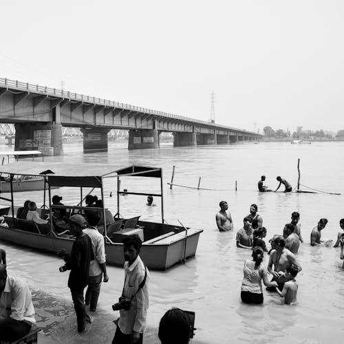 Grayscale Photo of People on the Beach