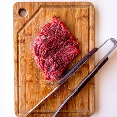Fresh cut of beef on a wooden board — photo by Fábio Bueno on Pexels