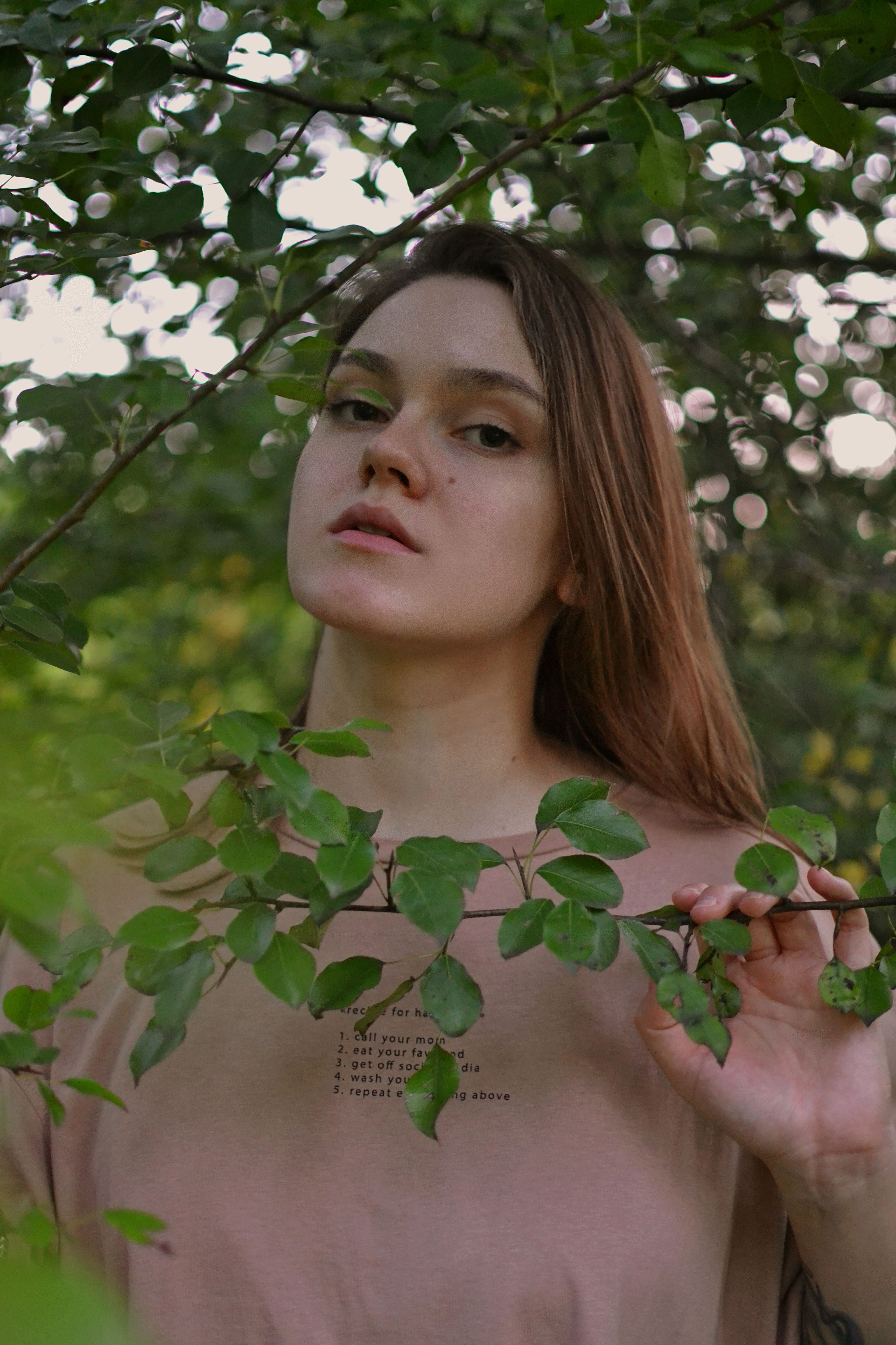 Young Woman Posing near Tree · Free Stock Photo