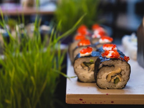 Delicious close-up shot of fresh sushi rolls adorned with roe, highlighting Japanese culinary artistry.