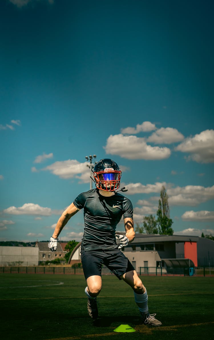 Man In A Football Helmet On A Field