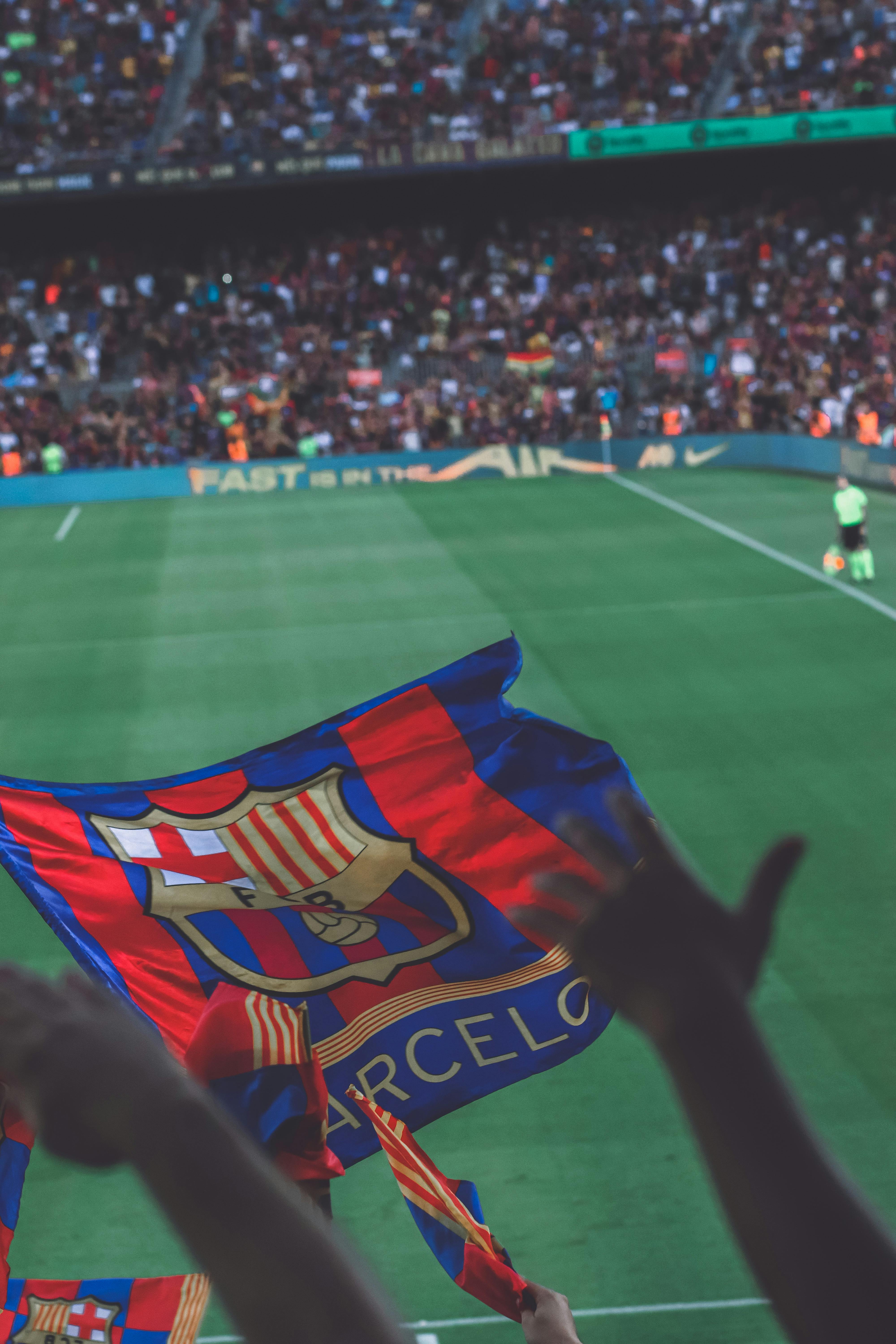 soccer match and a barcelona flag