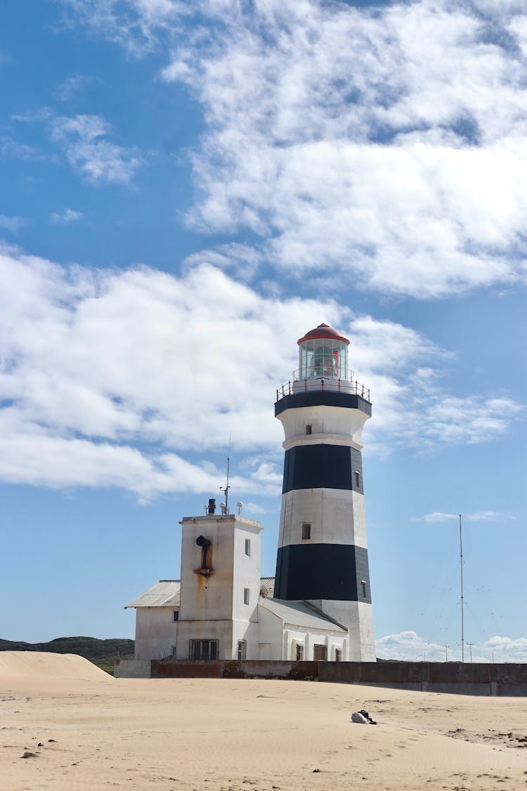 Lighthouse Tower Under White Clouds