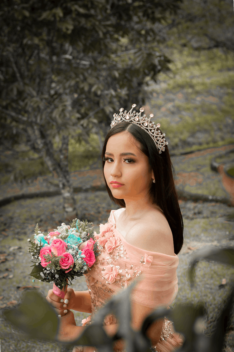 Photograph Of A Girl Holding A Bouquet Of Flowers