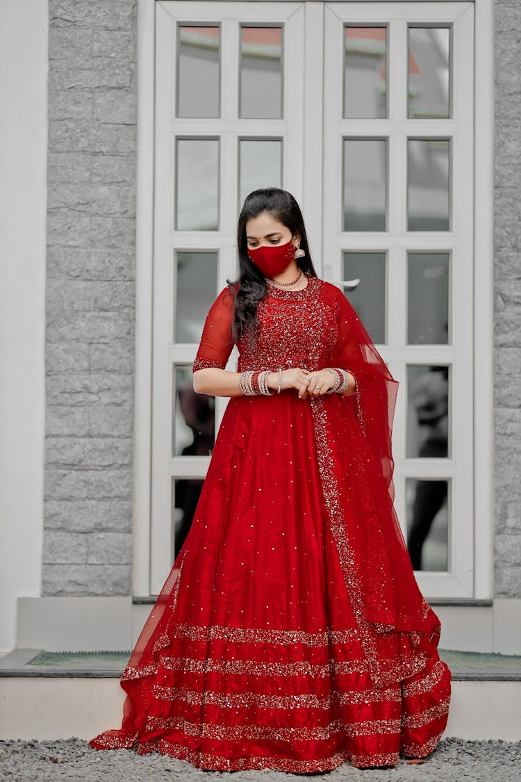 Woman Wearing Red Dress And Red Face Mask 