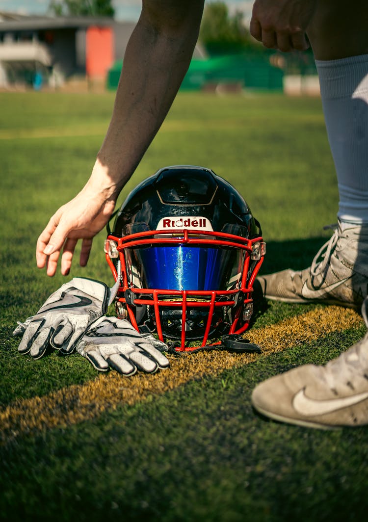 A Football Player Gear On The Grass