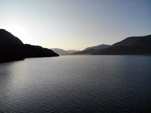 Free Tranquil morning view of a serene lake surrounded by mountains in San Martín de los Andes, Argentina. Stock Photo