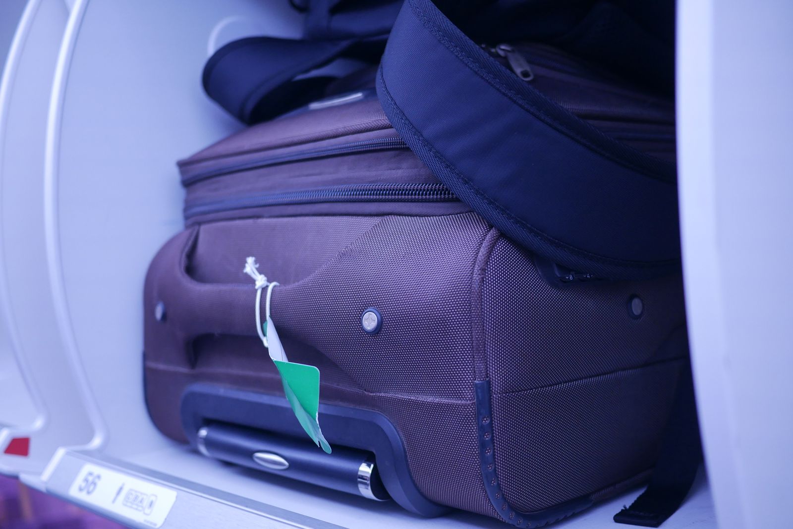 Carry-on luggage stored inside an airplane cabin