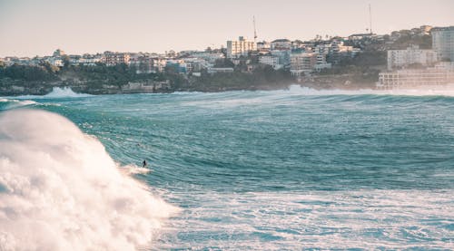 Rough Sea and the City on the Coast 