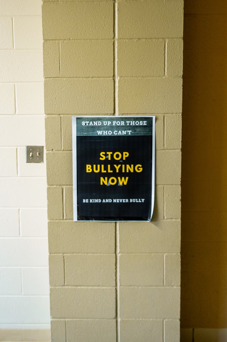 A Poster With Message Hanging On The Wall 