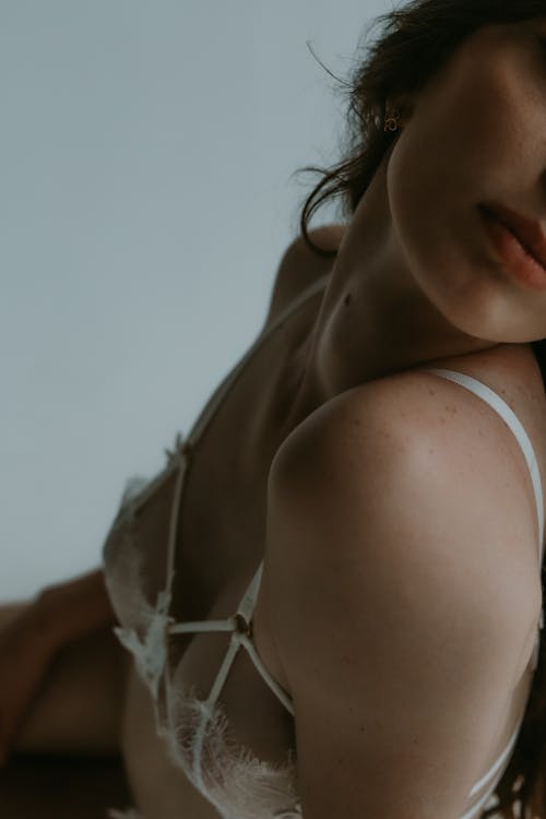 Close-up Photo of a Woman in a White Brassiere
