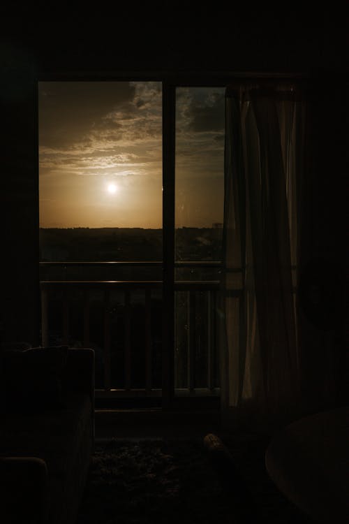 Darkness near Windows in Room at Sunset