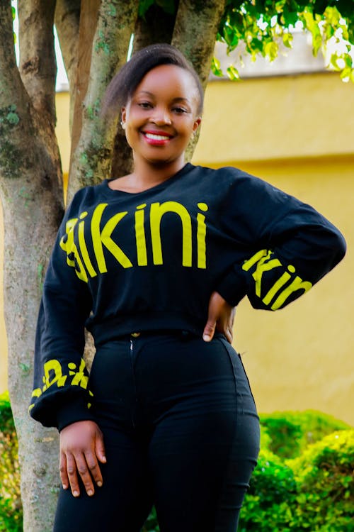 A Woman in Black and Yellow Long Sleeve Shirt