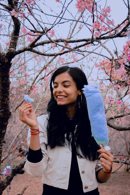 Young Woman with Cotton Candy in her Hand 