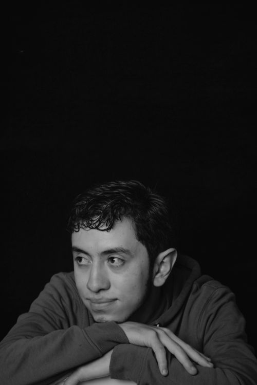 Free Black and white portrait of a young man with a contemplative expression. Stock Photo