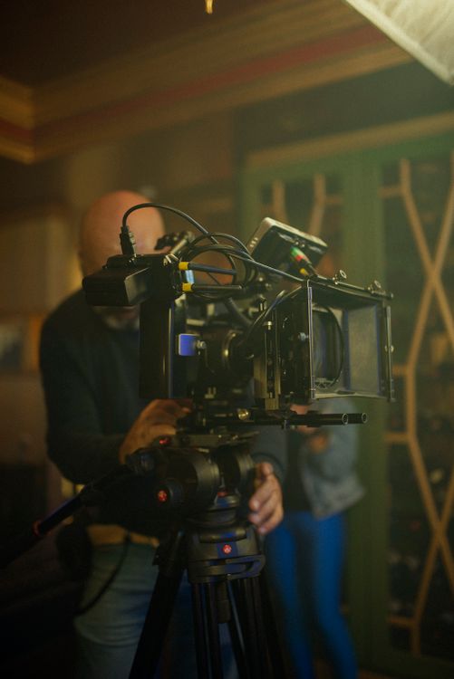 A Cameraman Using a Video Camera · Free Stock Photo