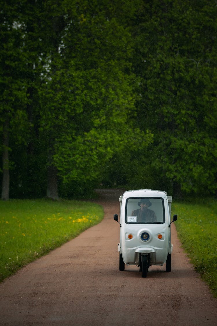 A Man Driving A Rickshaw