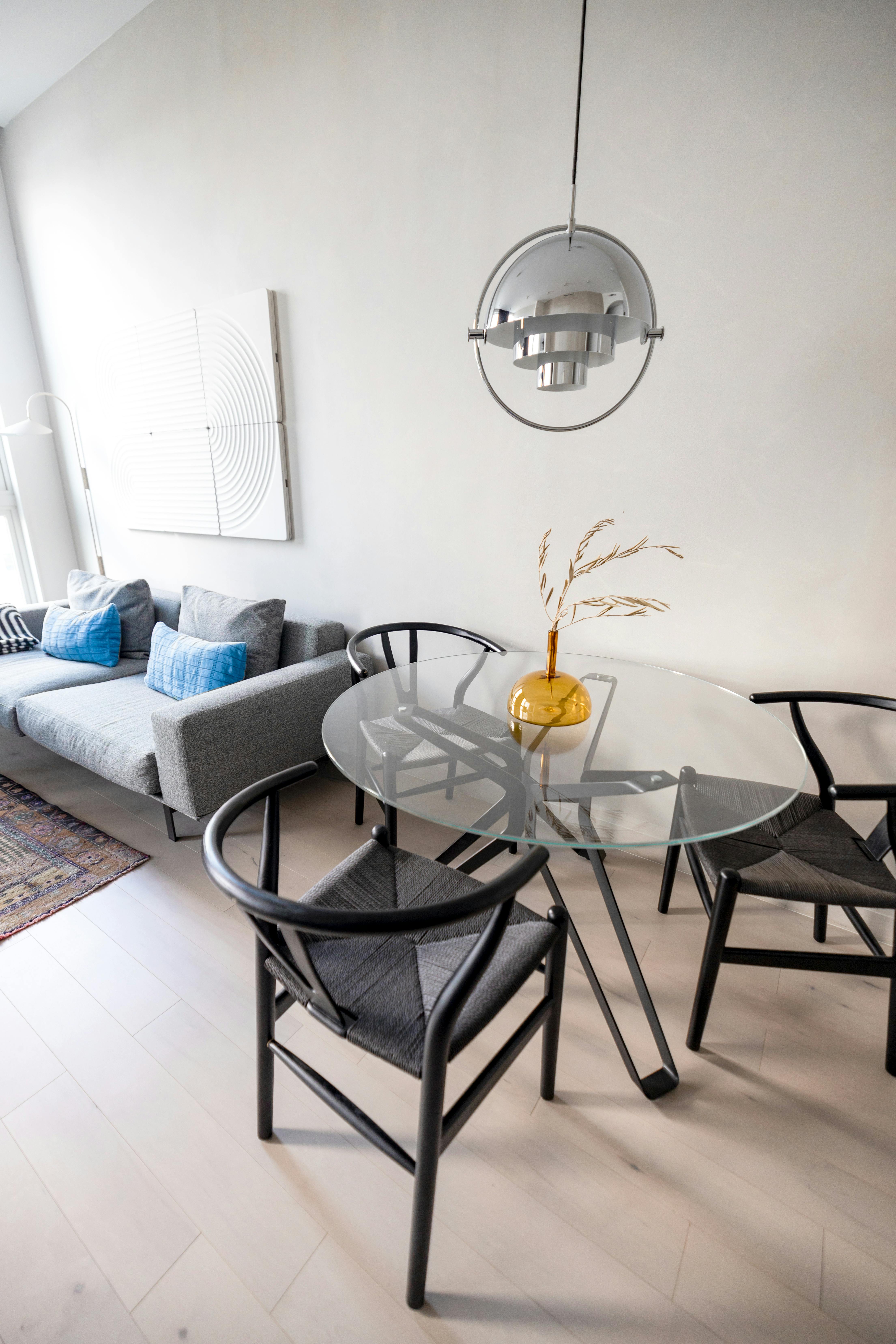 Chic living room setup featuring a glass dining table and stylish furniture in Philadelphia.