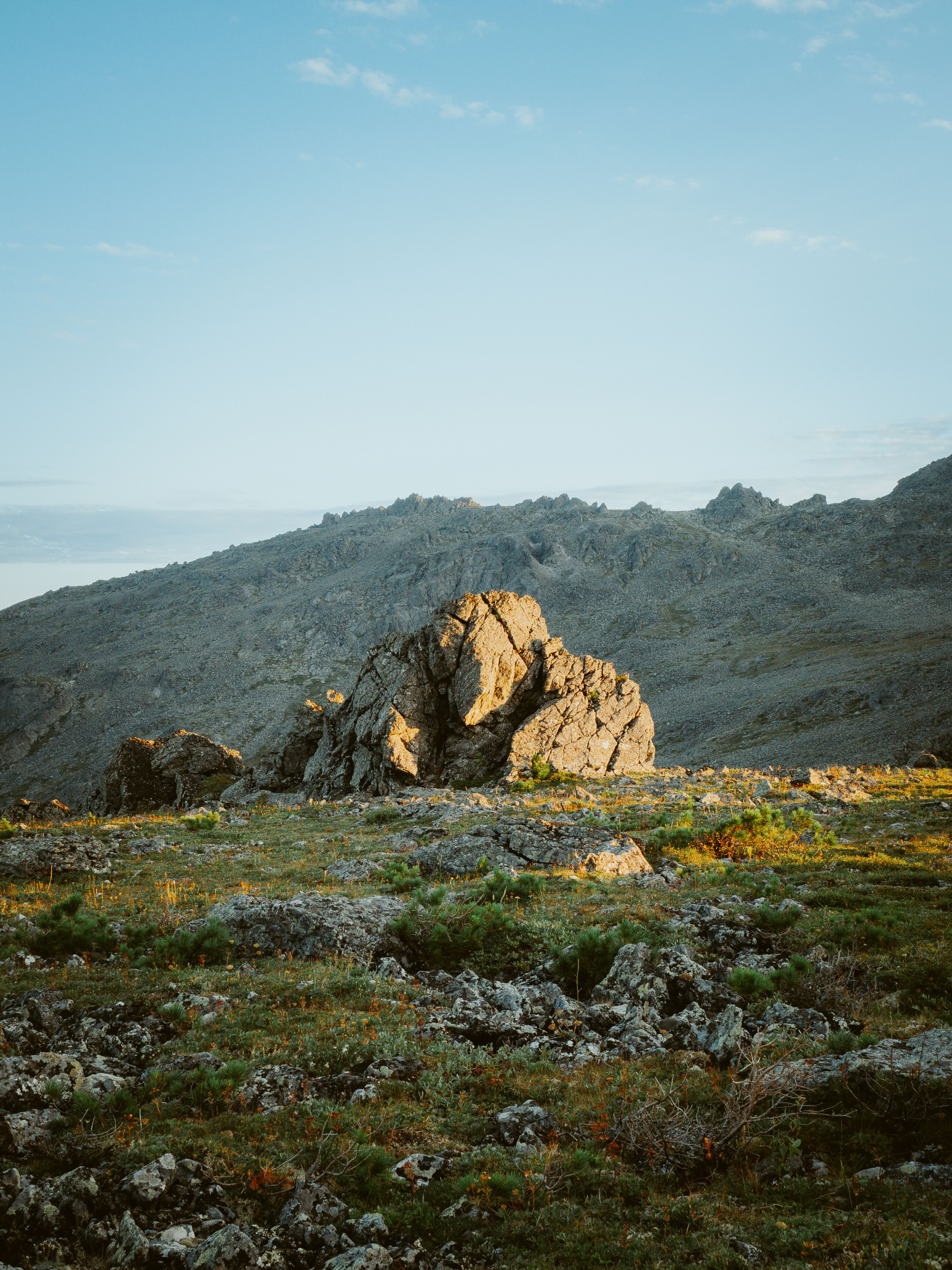 Brown Rock Formation on Grass Field · Free Stock Photo