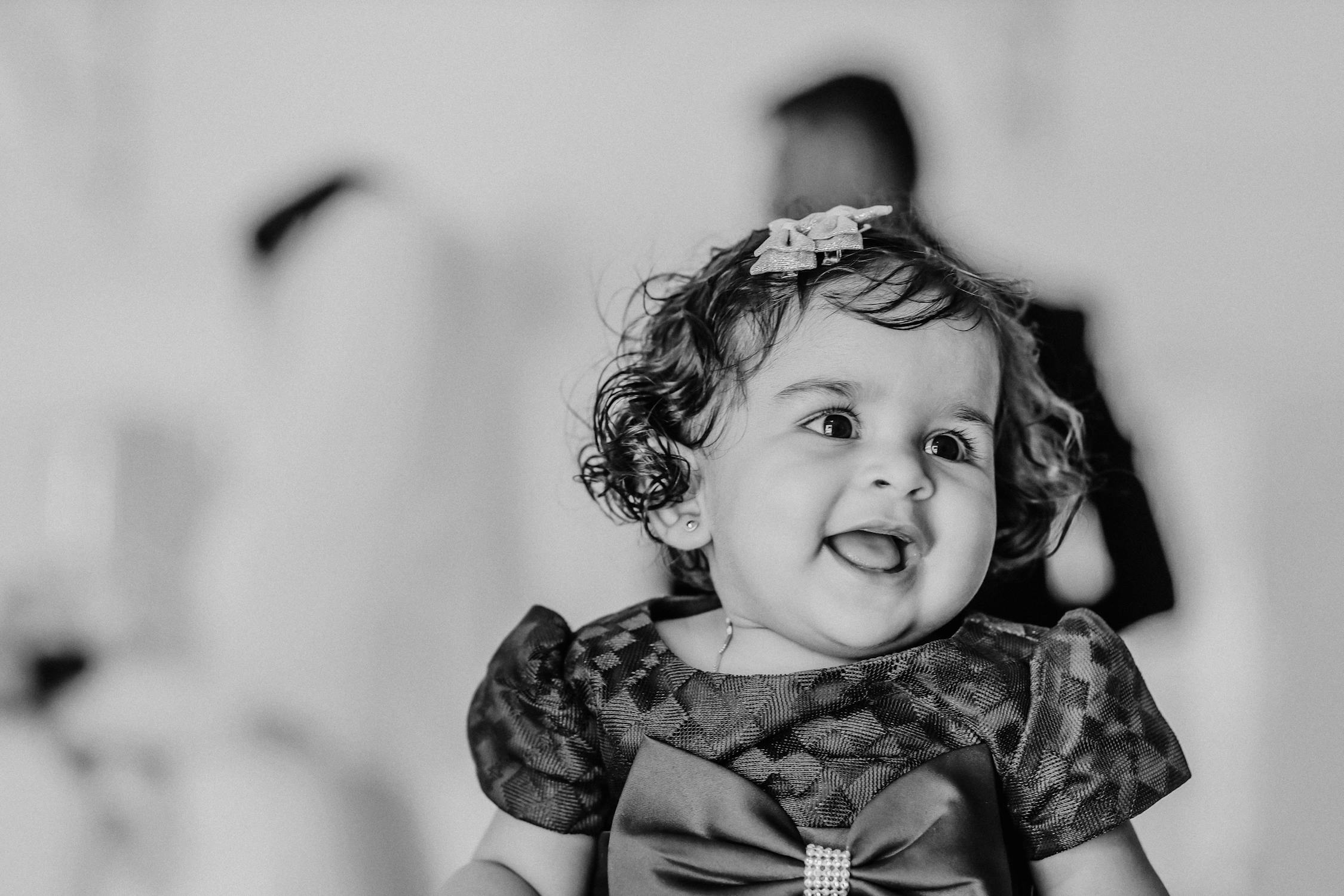 black-and-white-photo-of-a-smiling-baby-girl-free-stock-photo