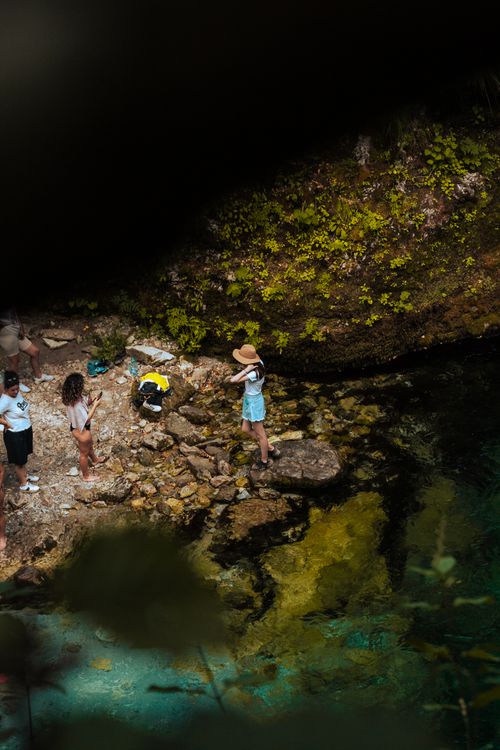 Free People exploring a beautiful gorge with a river and rocky landscape in Theth, Shkodër County, Albania. Stock Photo