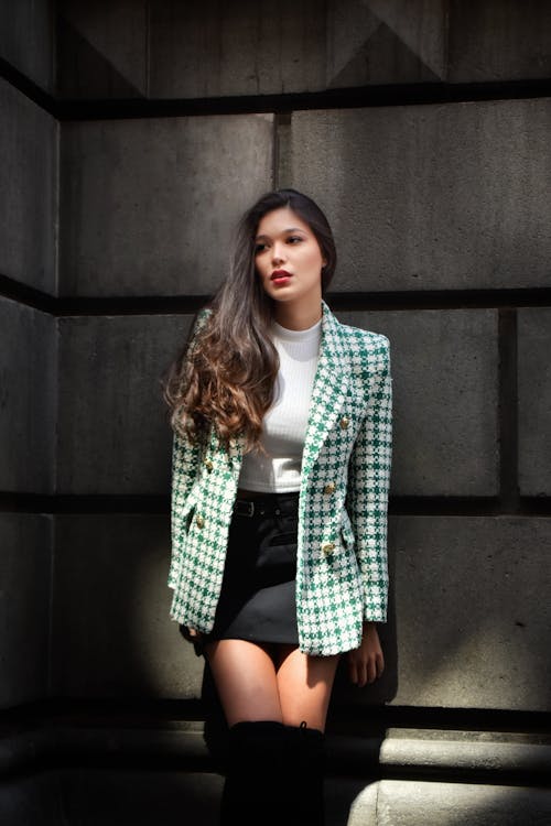 Woman in a Green and White Plaid Blazer and Black Skirt