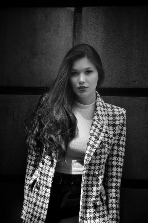 Free Stylish black and white portrait of a woman in Mexico City wearing a plaid blazer. Stock Photo
