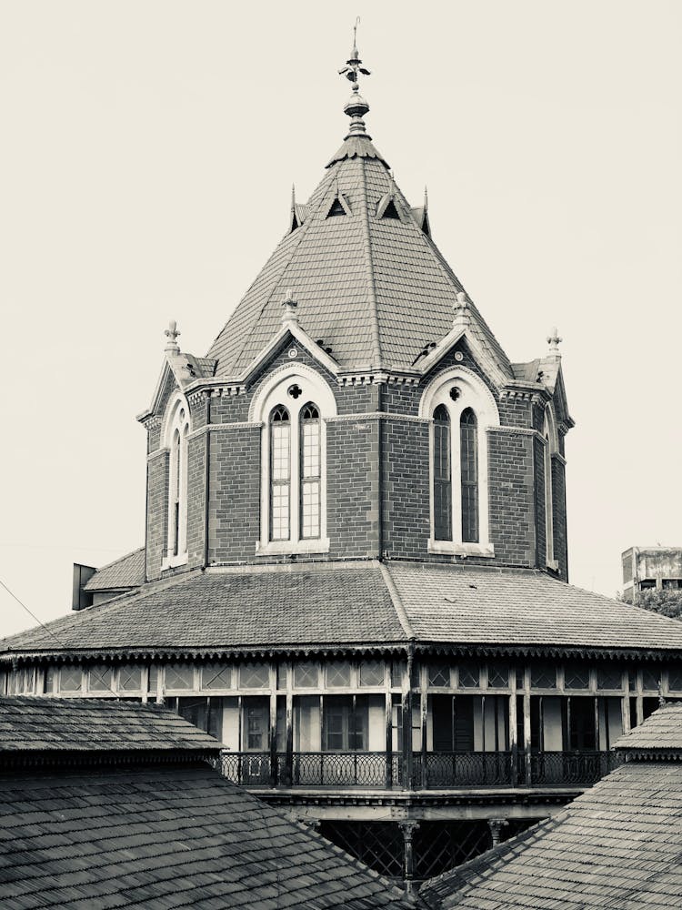 Sepia Toned Image Of A Tower With Balconies