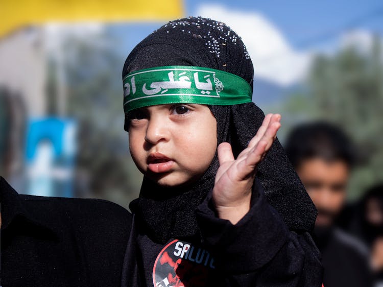 A Little Girl Wearing Black Hijab 