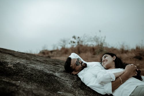 A Couple Lying on the Rock Together 