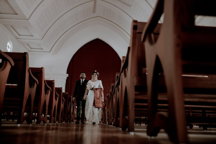 Couple Walking On The Aisle