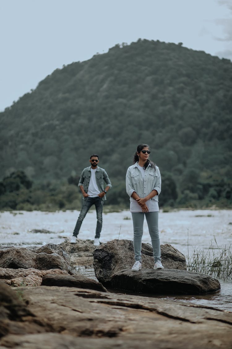 Man And Woman In Casual Clothes By River