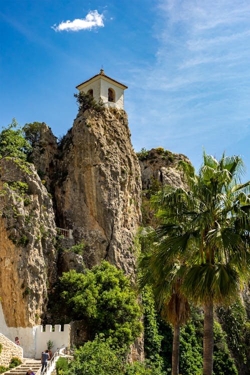 Building on Rock Formations over Palm Trees