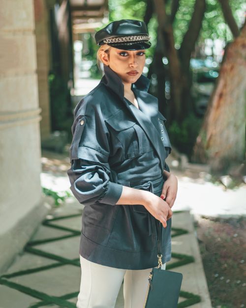 Free Stylish woman in black coat and cap in Isfahan, capturing modern Iranian fashion. Stock Photo