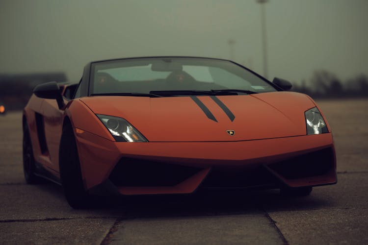 Red Lamborghini Car Parked On The Road