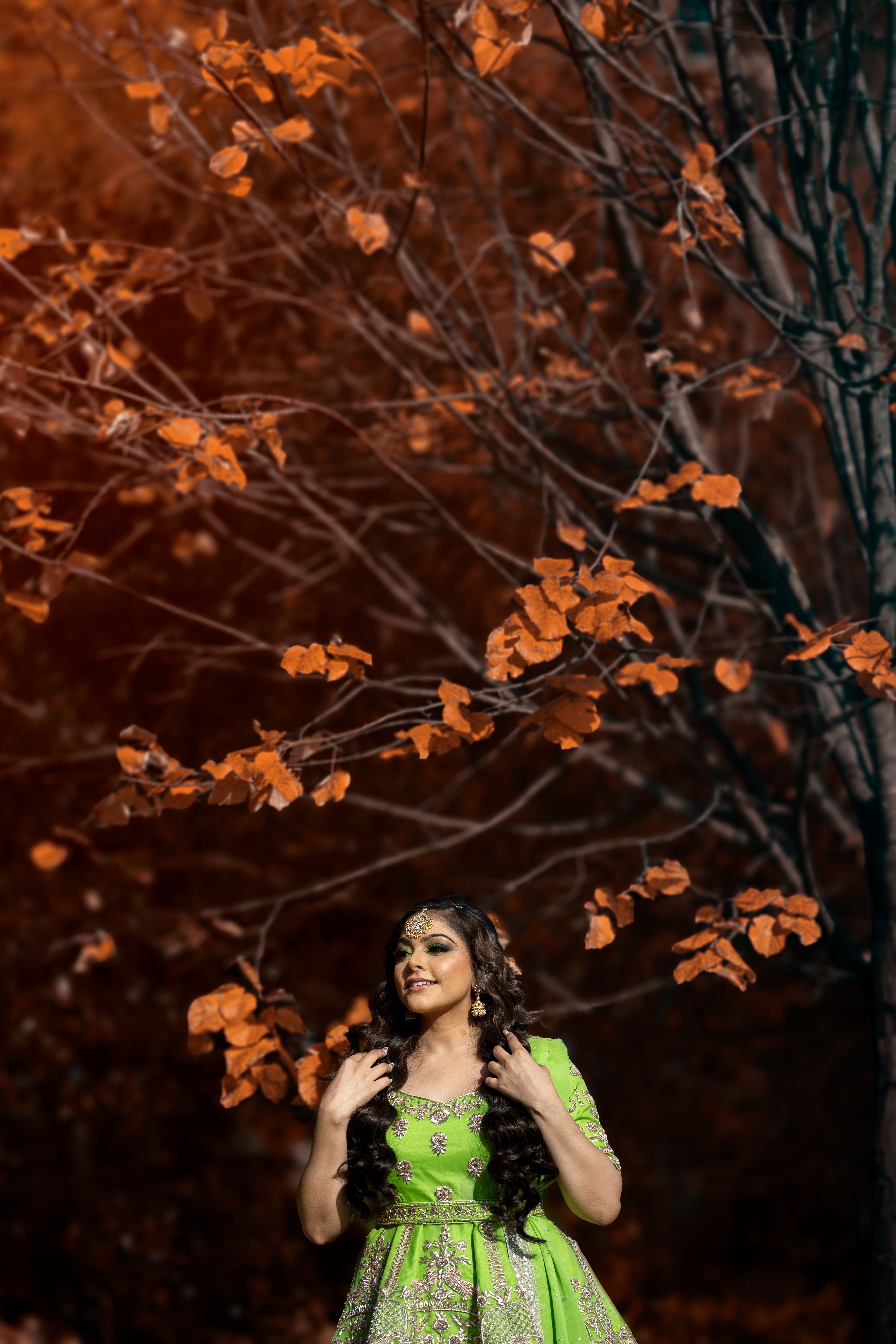A Beautiful Woman in Green Traditional Dress Standing Near Autumn Tree ...