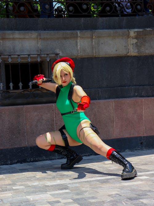 A Cosplayer Standing on the Sidewalk while Posing at the Camera