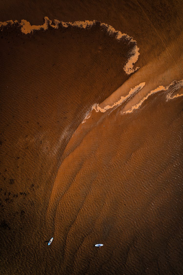 Top View Shot Of Water On The Shore