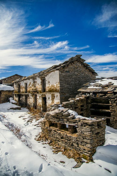 Free Ruined House on Snow Field Stock Photo