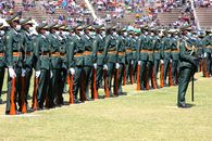 Uniformed soldiers in formation at a military parade in Harare, Zimbabwe.