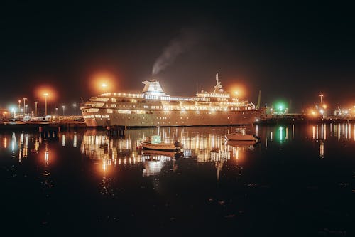 White Cruise Ship on Dock during Night Time